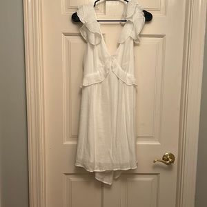 Francesca‘s white flowy tie back dress